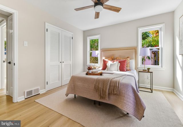 a bedroom with a bed and window