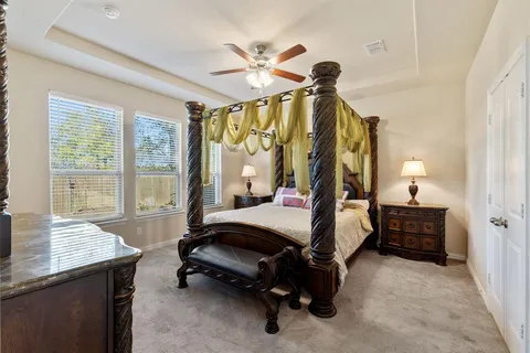 a bedroom with furniture and a window