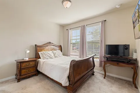 a bathroom with a toilet a sink and a mirror