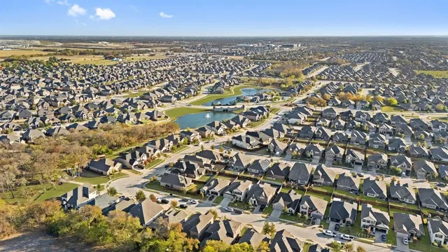 an aerial view of a house with a swimming pool