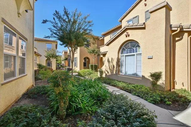 a view of a house with a small yard