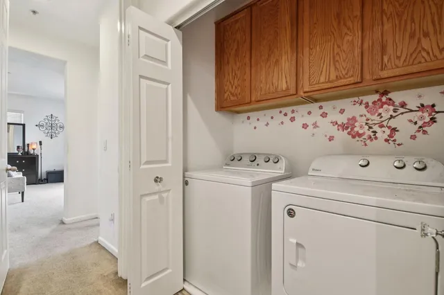 a view of bathroom with a washer and dryer