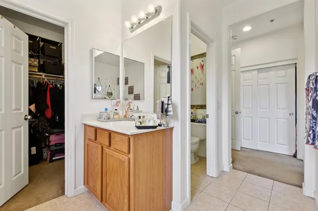 a bedroom with a bed and a table in it