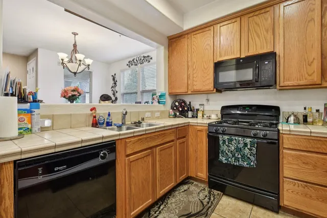 a kitchen with a sink stove and microwave