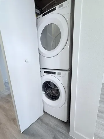 a bathroom with a double vanity sink toilet and a mirror