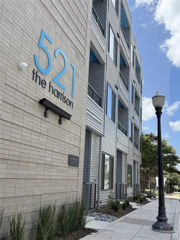 a street sign on a brick wall