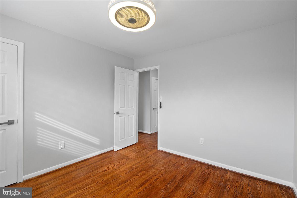 7845 Brompton Street Springfield, VA 22152 - Photo 18 of 32 a view of empty room with wooden floor