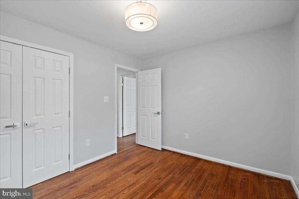 7845 Brompton Street Springfield, VA 22152 - Photo 22 of 32 a view of room with wooden floor and fan