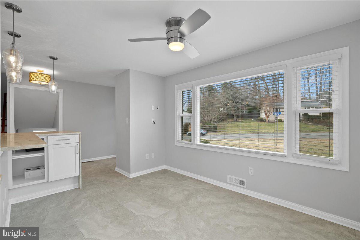 7845 Brompton Street Springfield, VA 22152 - Photo 7 of 32 a view of an empty room with a window