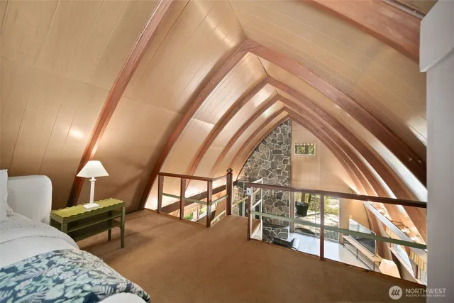 a view of a house with a tree in front of it