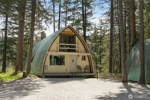 a view of a patio with table and chairs and potted plants