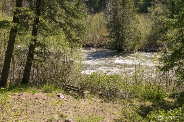a view of a door and chair in the balcony