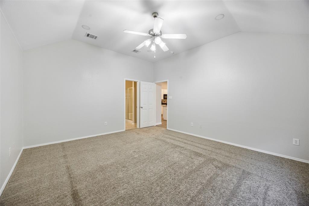 3603 Cottonwood Road Melissa, TX 75454 - Photo 10 of 27 Carpeted spare room with lofted ceiling and ceiling fan