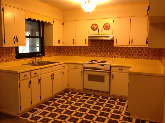 66 Reed Hollow Road Petersburg, TN 37144 - Photo 7 of 19 Think bright ad sunny with these yellow countertops, small but plenty of cabinets for all your favorite dishes!