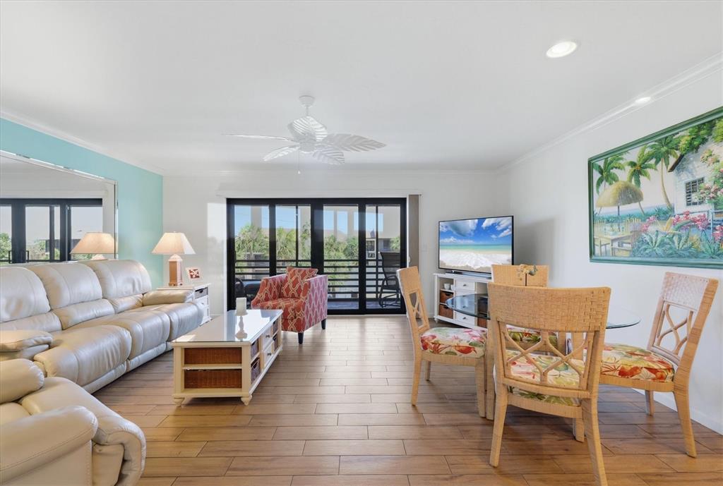 2729 North Beach Road, Unit 211 Englewood, FL 34223 - Photo 15 of 51 a living room with furniture and a large window