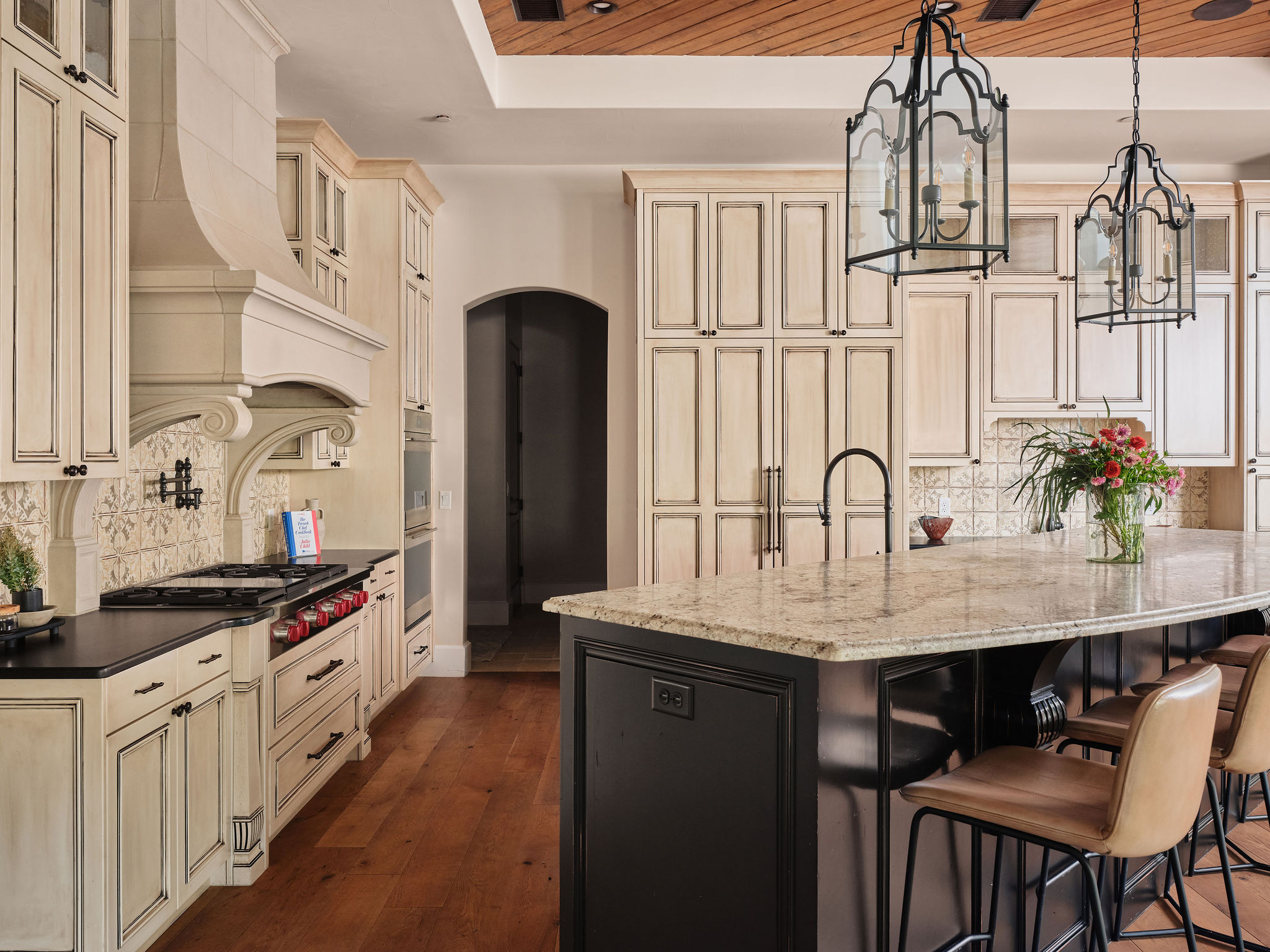 3667 Stoneridge Road Austin, TX 78746 - Photo 12 of 40 A large island anchors the kitchen, offering seating, prep space, and a natural place to linger.