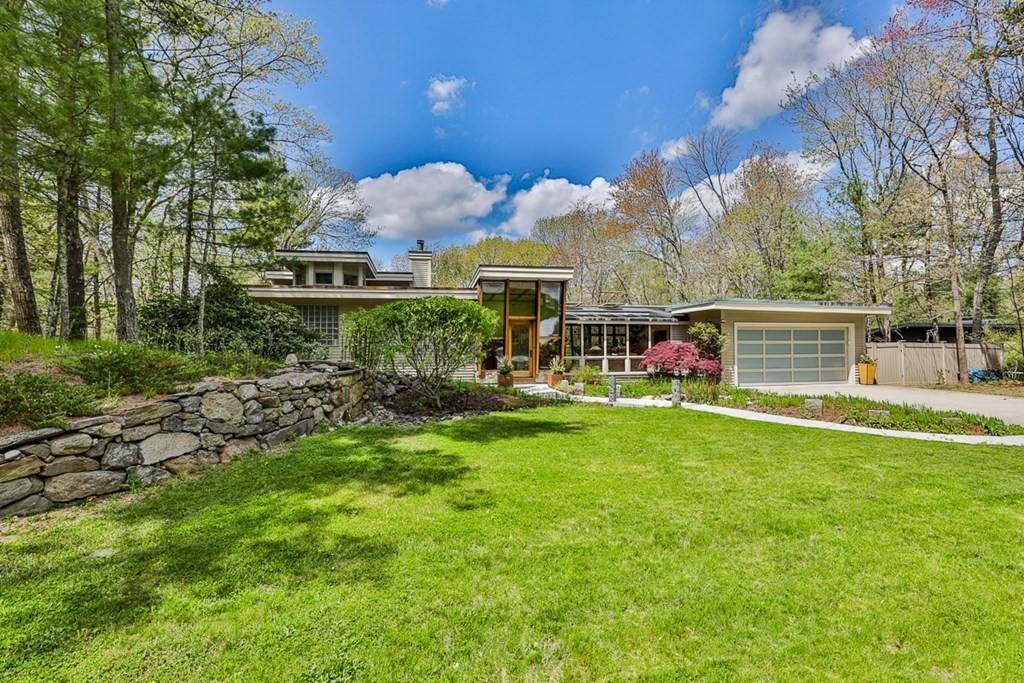 74 Woodside Road Harvard, MA 01451 - Photo 1 of 42 a front view of a house with a yard
