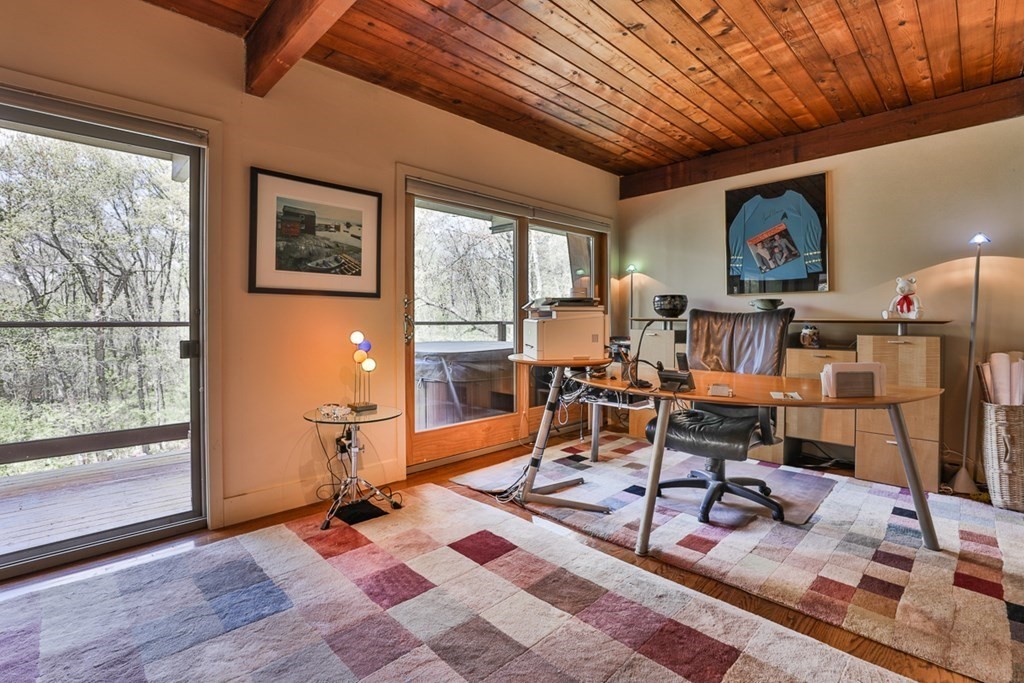 74 Woodside Road Harvard, MA 01451 - Photo 14 of 42 a living room with furniture a rug and a large window