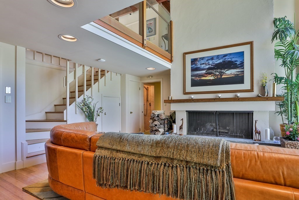 74 Woodside Road Harvard, MA 01451 - Photo 27 of 42 a living room with furniture and a fireplace