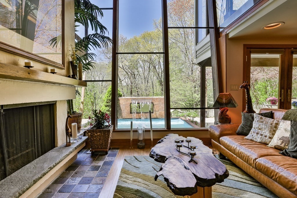 74 Woodside Road Harvard, MA 01451 - Photo 29 of 42 a living room with furniture and a floor to ceiling window