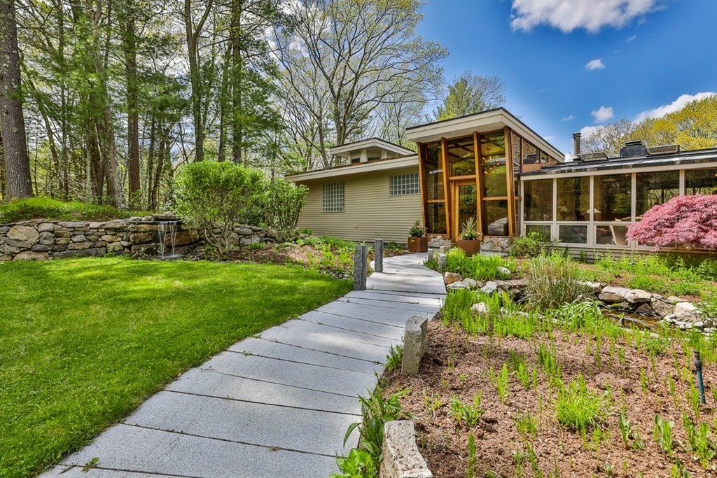 74 Woodside Road Harvard, MA 01451 - Photo 3 of 42 a front view of a house with a yard and potted plants