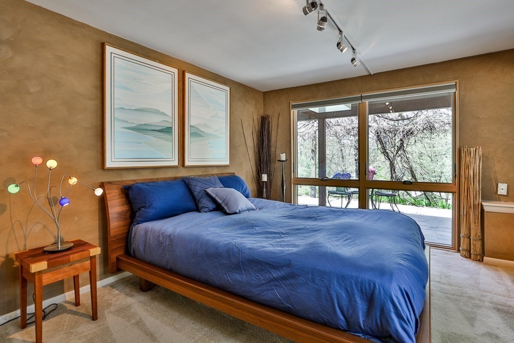 74 Woodside Road Harvard, MA 01451 - Photo 32 of 42 a bedroom with a bed and a large window