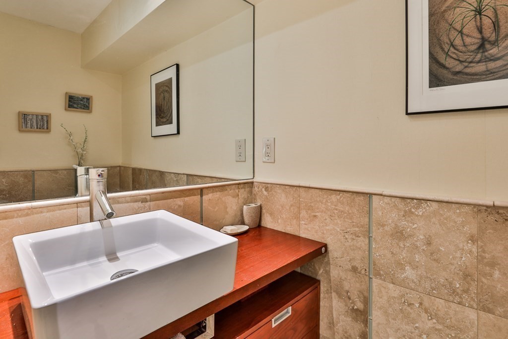 74 Woodside Road Harvard, MA 01451 - Photo 33 of 42 a bathroom with a sink and a large mirror