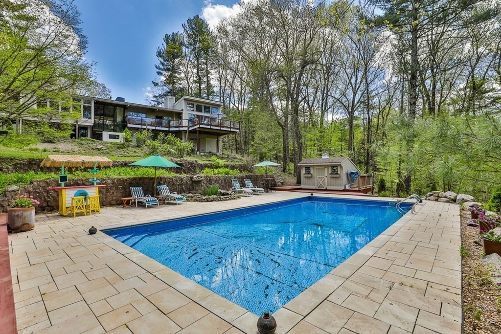 74 Woodside Road Harvard, MA 01451 - Photo 39 of 42 a view of a swimming pool with a patio