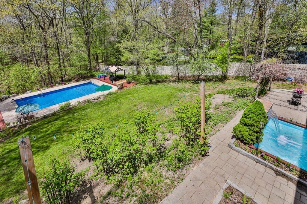 74 Woodside Road Harvard, MA 01451 - Photo 41 of 42 a view of a garden with an outdoor space