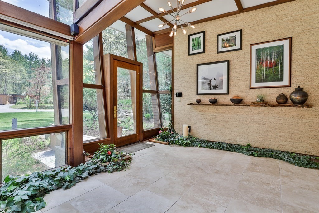 74 Woodside Road Harvard, MA 01451 - Photo 5 of 42 a front view of a house with a garden