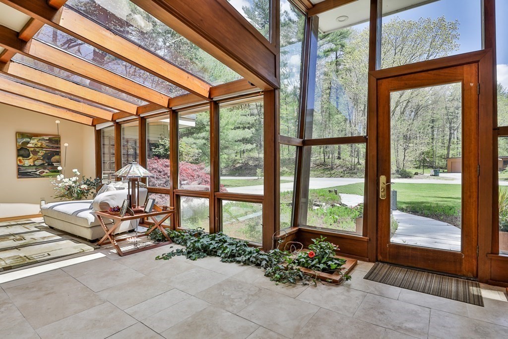 74 Woodside Road Harvard, MA 01451 - Photo 6 of 42 a living room with furniture and floor to ceiling windows