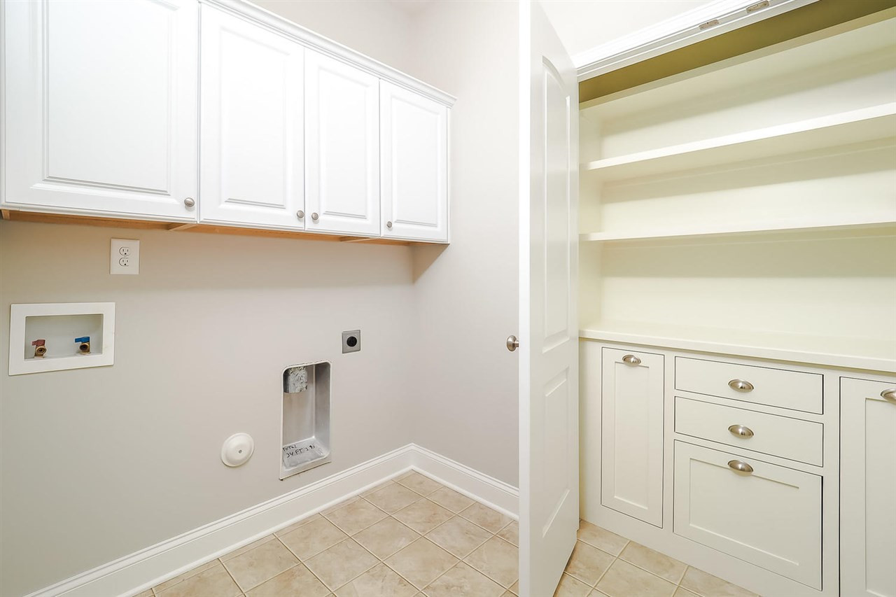 2038 Crockett Ridge Road Fuquay-Varina, NC 27526 - Photo 10 of 25 Laundry room with custom built in cabinets. laundry room