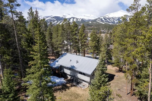 a view of a backyard with sitting area