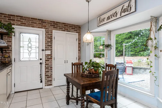a view of a dining room with furniture window and outside view