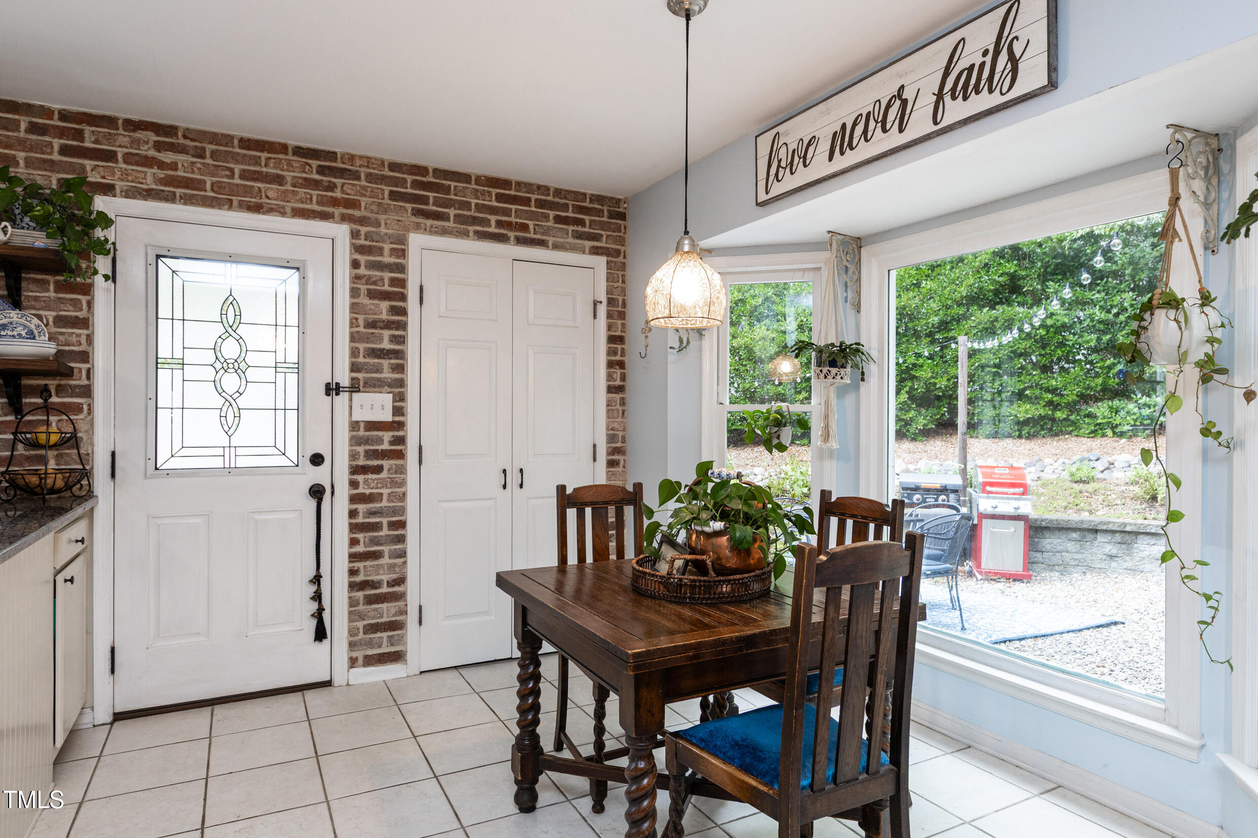 12116 Queensbridge Court Raleigh, NC 27613 - Photo 5 of 16 a view of a dining room with furniture window and outside view