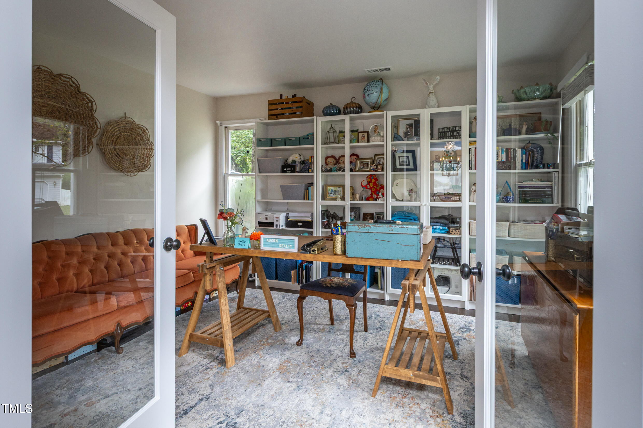 12116 Queensbridge Court Raleigh, NC 27613 - Photo 8 of 16 a work room with furniture a rug and a window