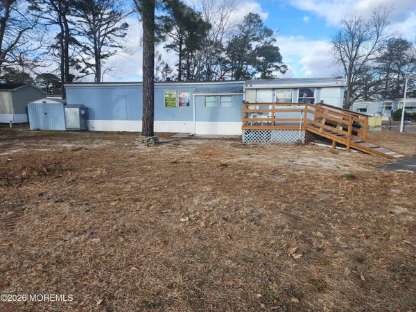 a front view of a house with swing