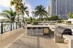 600 Northeast 36th Street, Unit 507 Miami, FL 33137 - Photo 19 of 23 a outdoor patio with swimming pool and sitting space