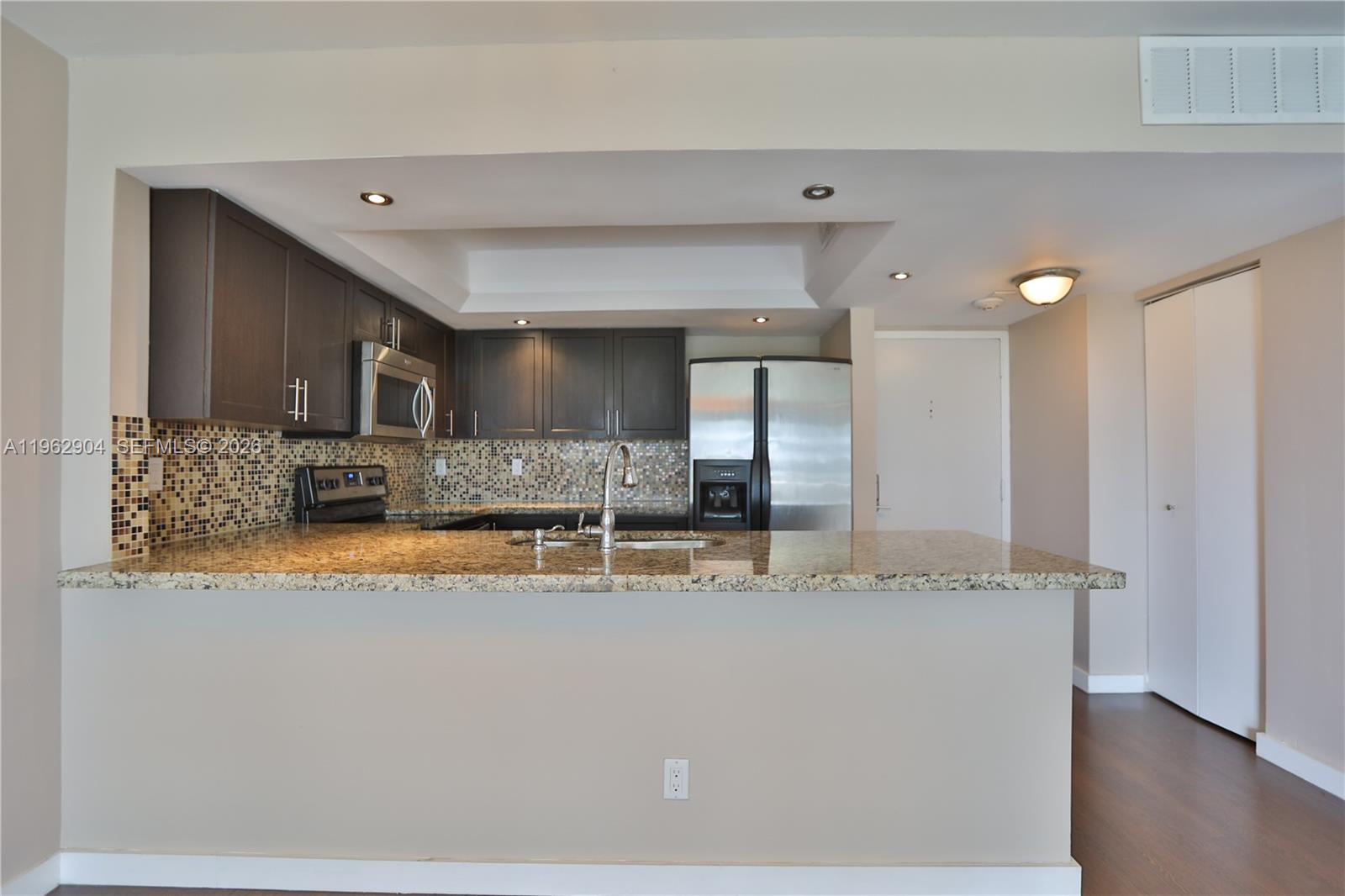 600 Northeast 36th Street, Unit 507 Miami, FL 33137 - Photo 5 of 23 a view of a kitchen with granite countertop