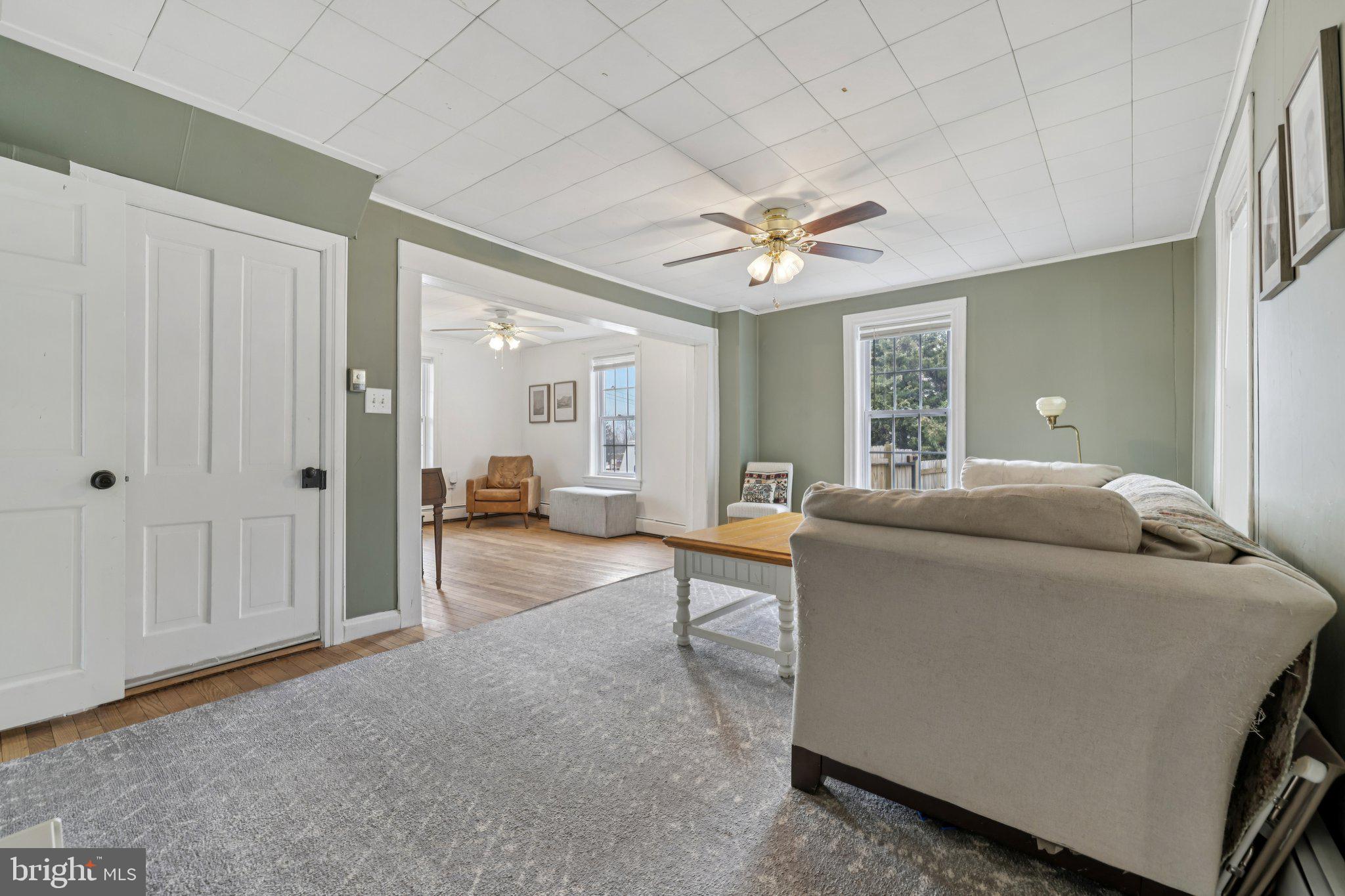 22538 Old Georgetown Road Smithsburg, MD 21783 - Photo 12 of 50 a living room with furniture and a chandelier