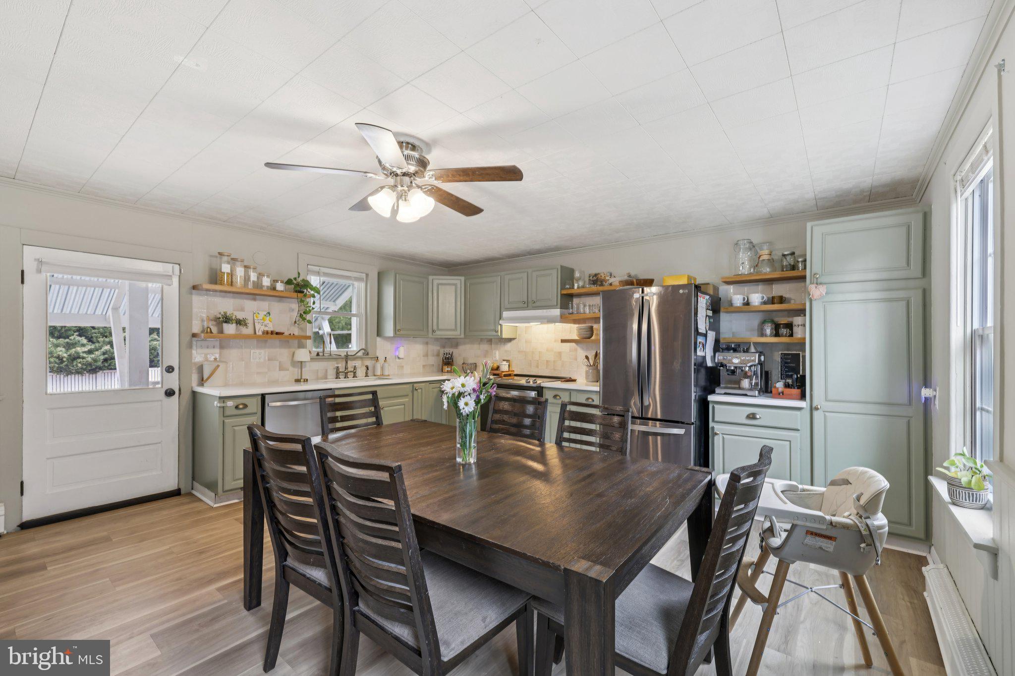 22538 Old Georgetown Road Smithsburg, MD 21783 - Photo 14 of 50 a view of a dining room with furniture and wooden floor