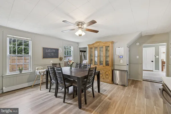 a view of a dining room with furniture and window