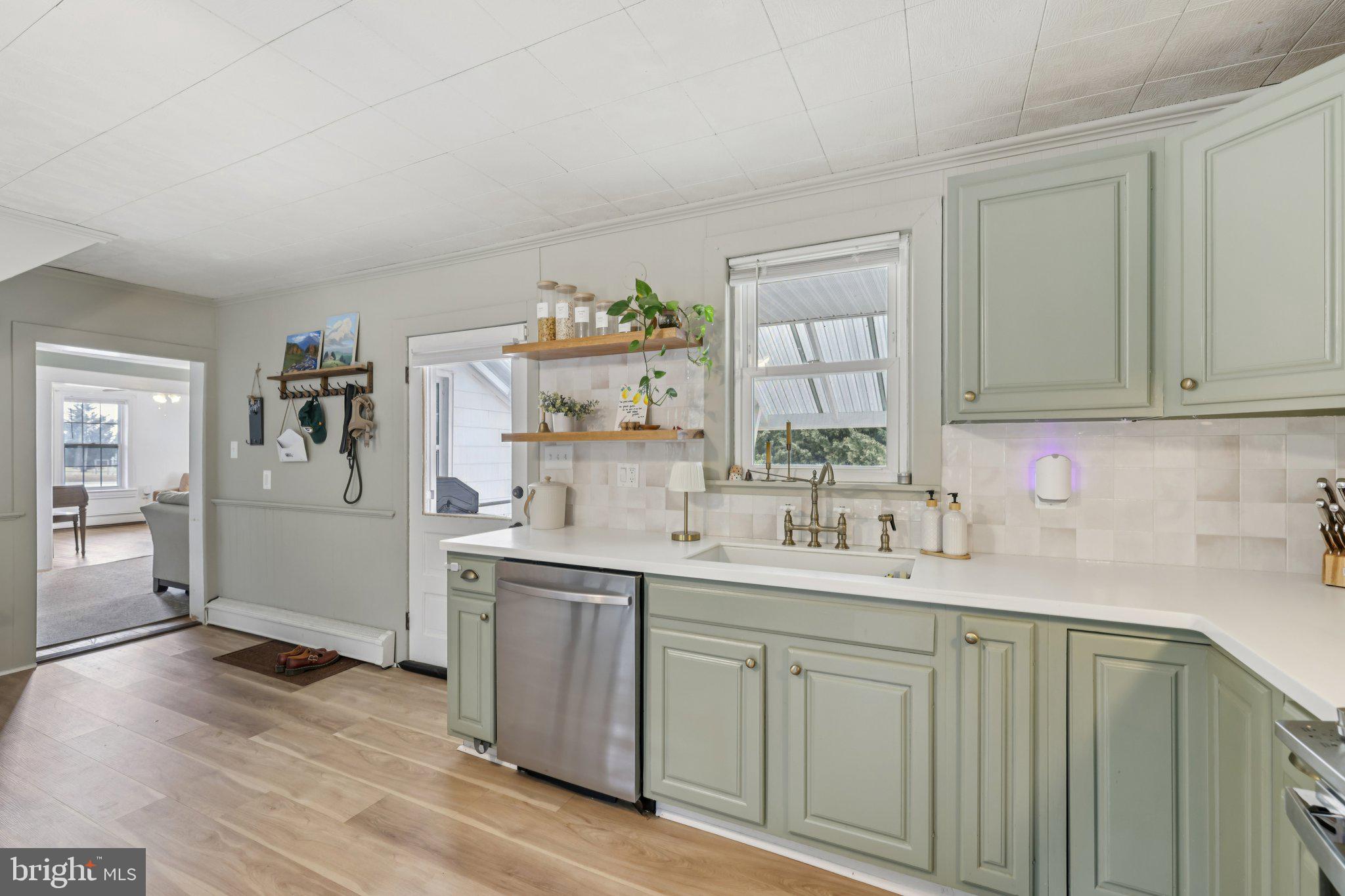 22538 Old Georgetown Road Smithsburg, MD 21783 - Photo 18 of 50 a kitchen with a sink cabinets and wooden floor