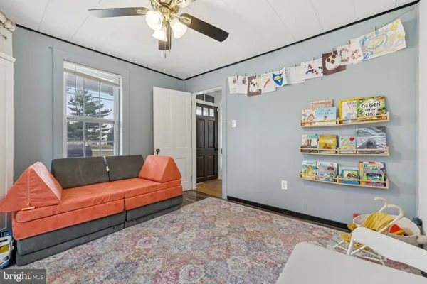a living room with furniture and a window