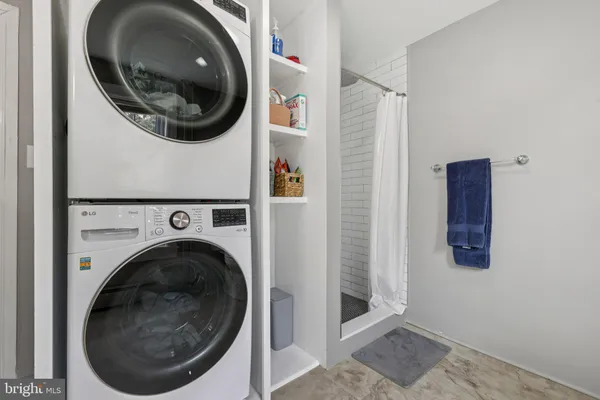 a view of a hallway with washer and dryer
