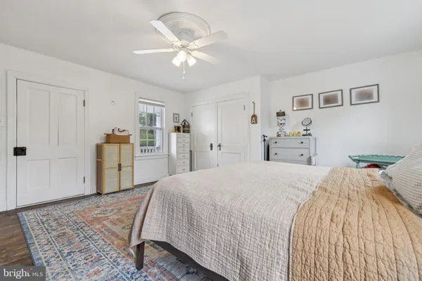 a bed room with a bed and a chandelier