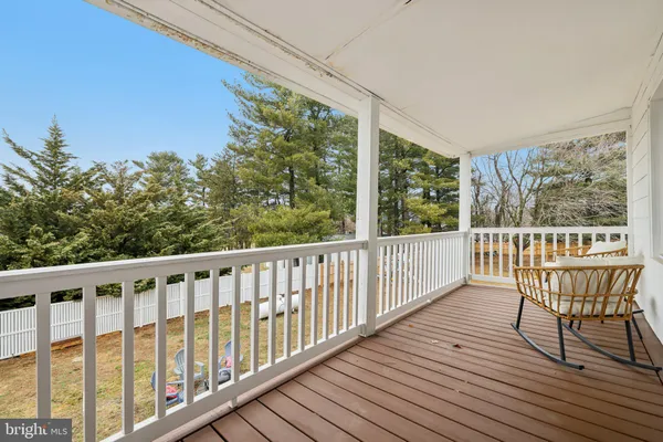 a view of a two chairs in the balcony