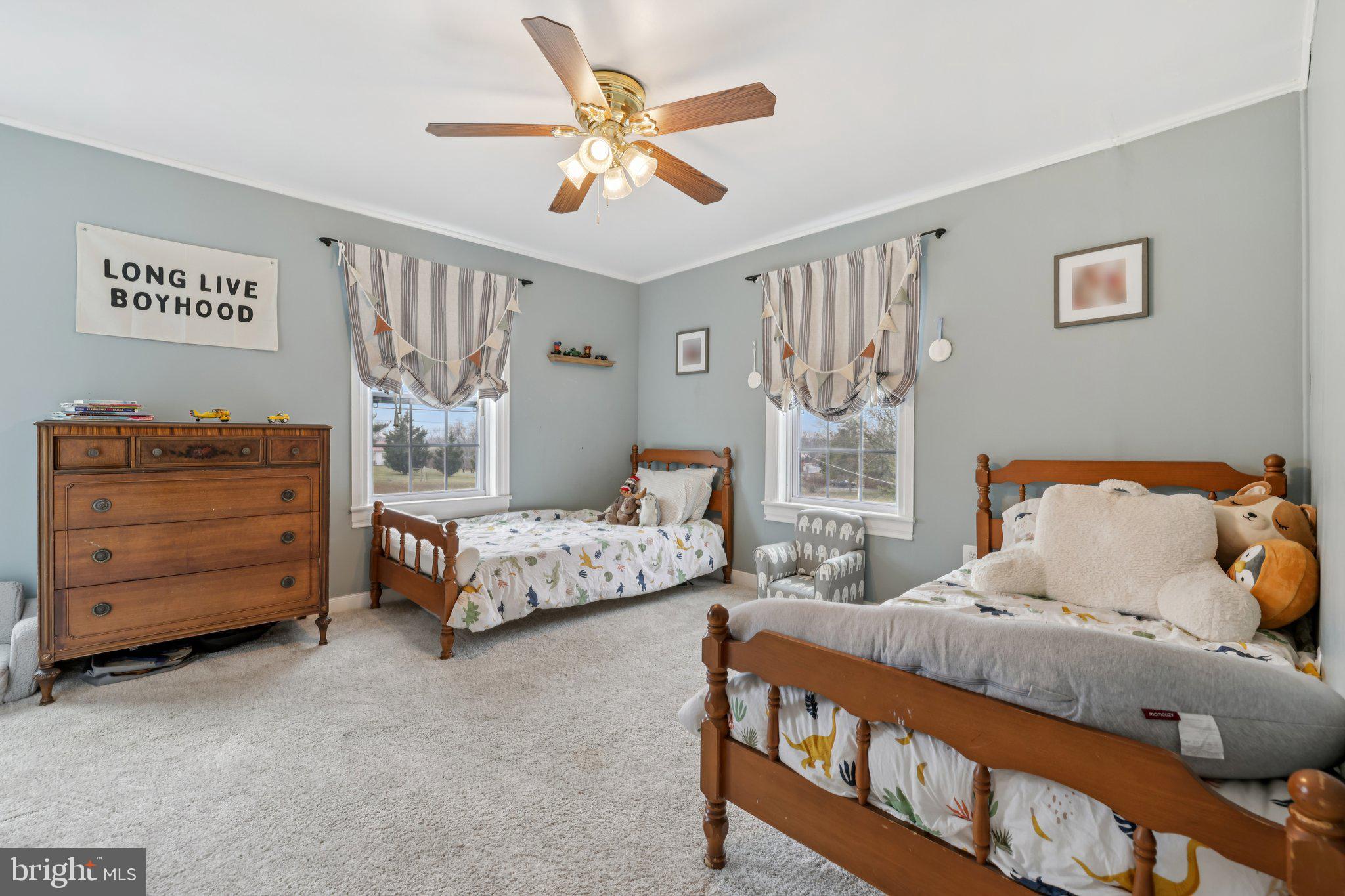 22538 Old Georgetown Road Smithsburg, MD 21783 - Photo 29 of 50 a bedroom with a bed and a chandelier