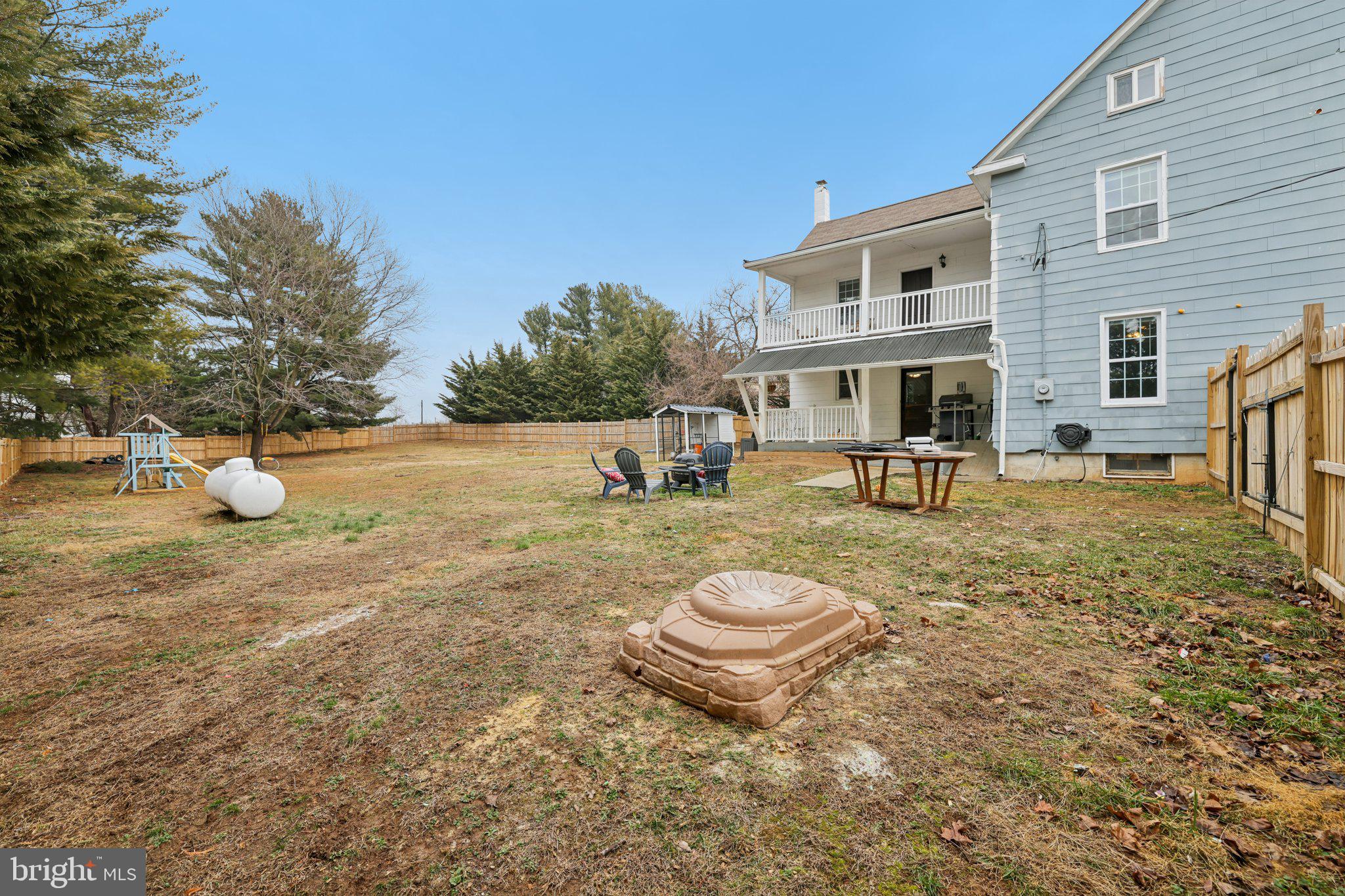 22538 Old Georgetown Road Smithsburg, MD 21783 - Photo 39 of 50 a view of a white house with table and chairs