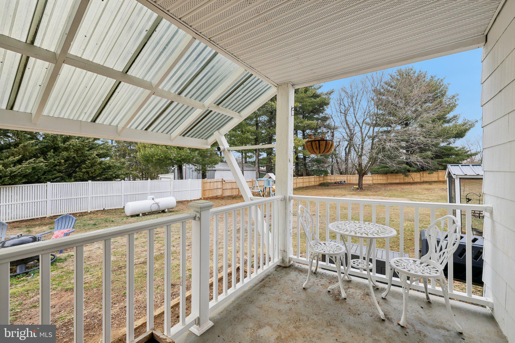 22538 Old Georgetown Road Smithsburg, MD 21783 - Photo 41 of 50 a view of a porch with wooden floor